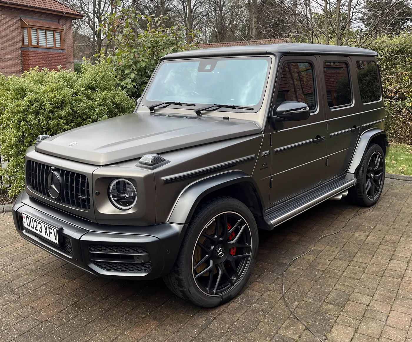Front right view of a grey Mercedes G-Wagon after exterior detailing